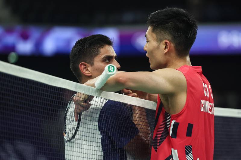 Olympic Badminton: Zhou Tianchen and Luis Ramon Garrido's Resilient Match